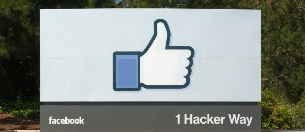 The entrance sign to Facebook 1 Hacker Way