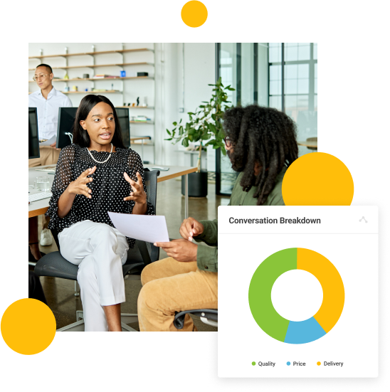 Two women having a discussion in an office setting.